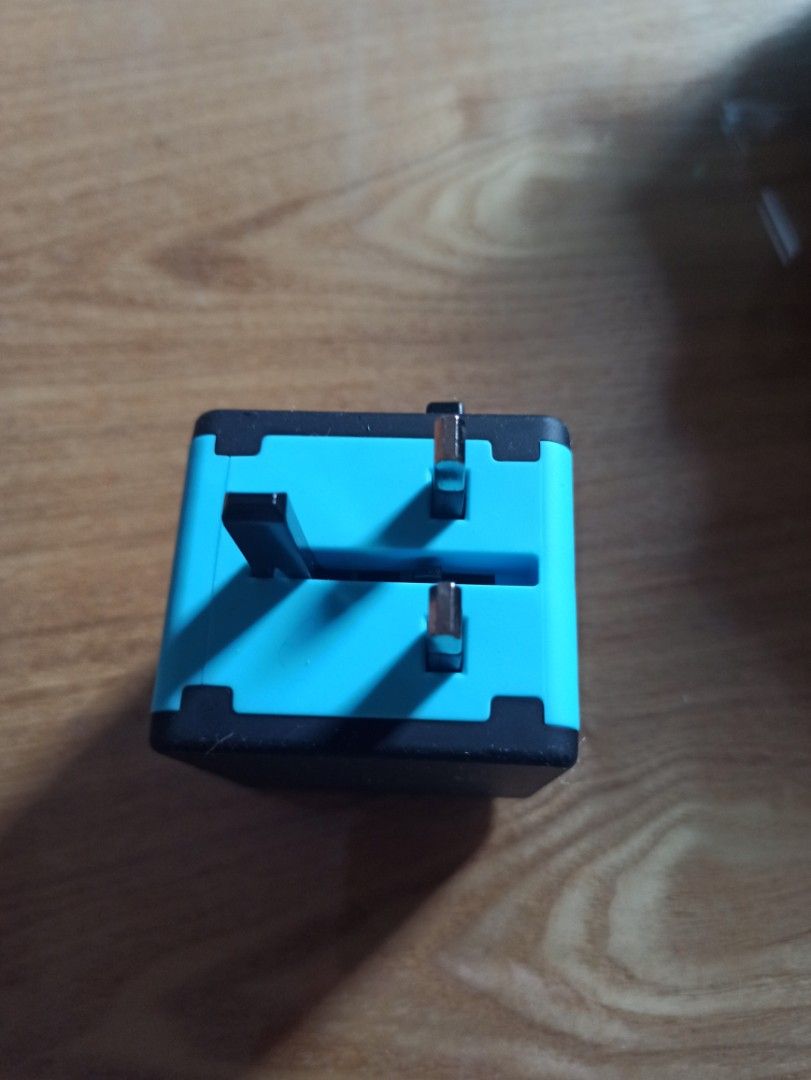 Universal World Travel Plug featuring four USB ports and a multiple AC socket (Category: Electrical, Adaptors & Sockets) located in Caloocan City. Submitted by rtarellano (Listing ID 1454227955, Image 2). Description: - Universal World Travel Plug - Features 4 USB ports (2.1A, 2.1A, 2.4A, 2.4A) - Includes 1 universal AC socket - Compatible with USA/AUS, Europe, and UK outlets - Compact and portable design - Ideal for international travel.