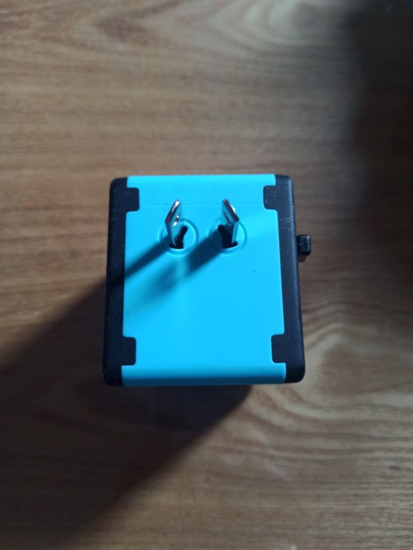 Universal World Travel Plug featuring four USB ports and a multiple AC socket (Category: Electrical, Adaptors & Sockets) located in Caloocan City. Submitted by rtarellano (Listing ID 1454227955, Image 3). Description: - Universal World Travel Plug - Features 4 USB ports (2.1A, 2.1A, 2.4A, 2.4A) - Includes 1 universal AC socket - Compatible with USA/AUS, Europe, and UK outlets - Compact and portable design - Ideal for international travel.