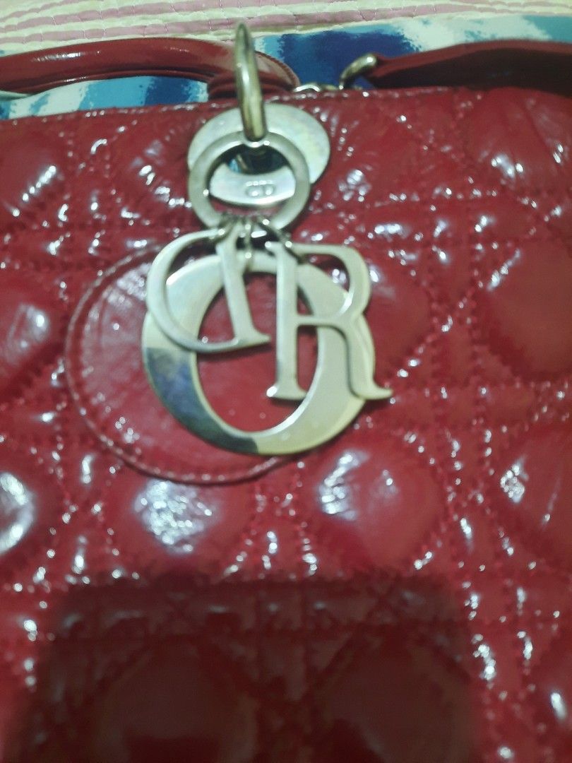 !REPRICED!Vintage Lady Dior (Category: Luxury Bags & Wallets) located in Amadeo. Submitted by thebagreserve (Listing ID 1454195993, Image 1). Description: Vintage Dior Lady Dior Cannage Quilted Patent Leather Handbag – Cherry Red ( From P4500 to P3500) * With code * Please self authenticate ! No Return No Exchange ! ​Elevate your wardrobe with this iconic Lady Dior handbag crafted in glossy cherry red patent leather featuring Christian Dior's sig
