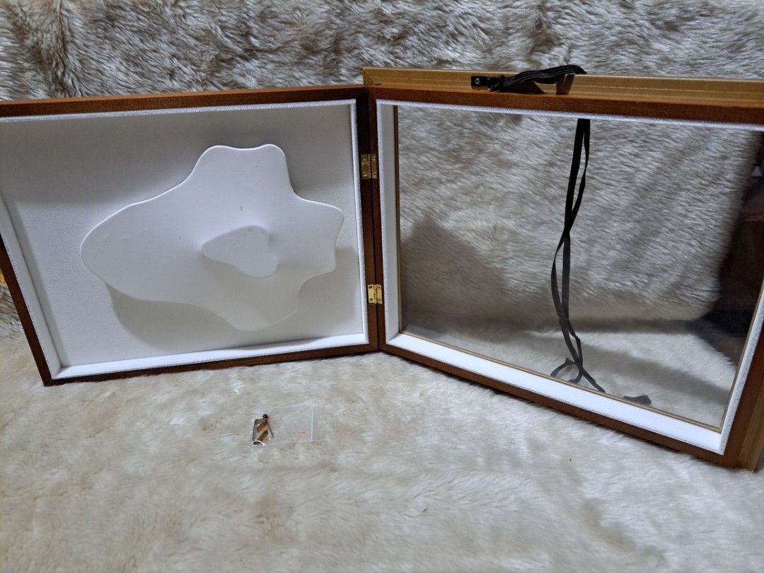 Vintage Style Shadow Box Frame with Display Insert (Category: Frames & Pictures) located in Quezon City. Submitted by sbvdmanaog (Listing ID 1454354102, Image 3). Description: - Elegant wooden shadow box frame - Ornate gold trim - White cloud/abstract display insert - Hinged opening with clear glass front - Includes a bag of miniature decorative items - Ideal for showcasing small collectibles or keepsakes - Solid wood back.