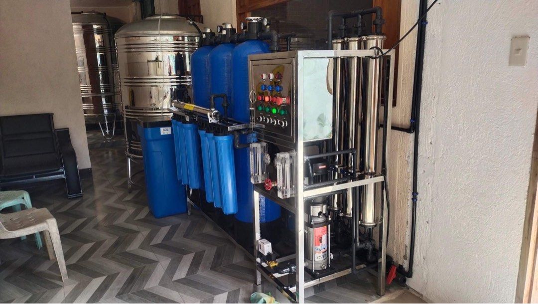 Water Refilling Station Package (Category: Industrial Equipment) located in Las Pinas. Submitted by johnskeez (Listing ID 1454192990, Image 2). Description: Water Refilling Station Package setup Single membrane Double membrane Triple membrane With Freebies - Complete water filtration setup - Multiple large blue filter housings - Three large blue tanks - Control panel with indicator lights and gauges - Stainless steel frame and components - Robust