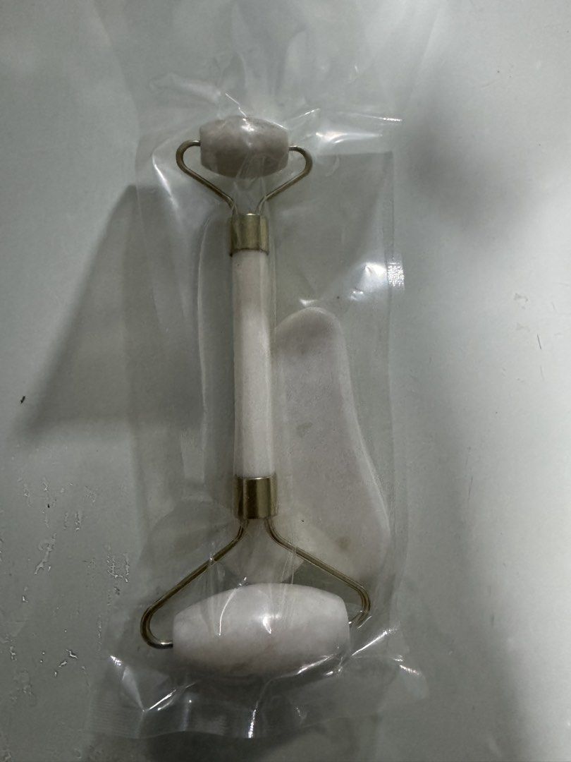 White Jade Roller and Gua Sha Set (Category: Face Care) located in Manila. Submitted by decluterthings888 (Listing ID 1454295557, Image 1). Description: - Includes a white jade roller and gua sha tool with gold hardware. - Perfect for facial massage and enhancing your skincare routine. - Helps reduce puffiness and improve blood circulation. - Simple and easy to use for daily self-care..