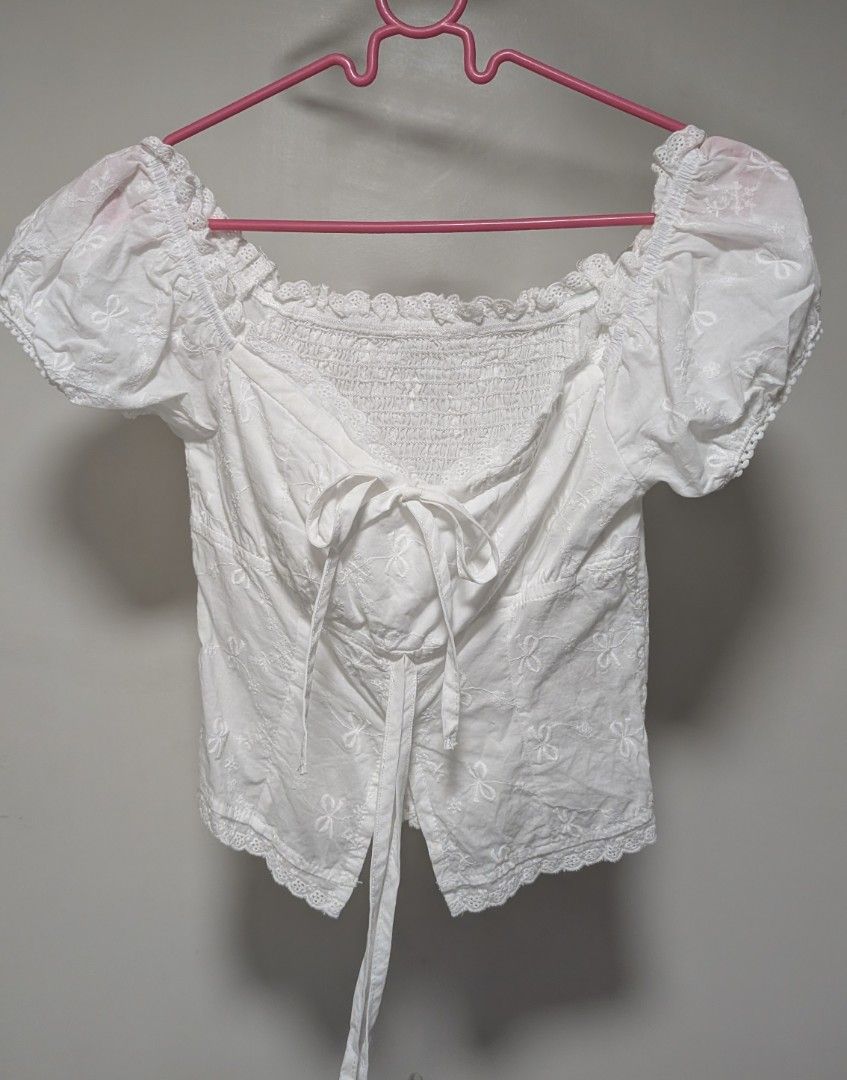 White Off-Shoulder Puff Sleeve Tie-Front Crop Top (Category: Blouses) located in Manila. Submitted by yuna.com (Listing ID 1454314190, Image 3). Description: rfs. too small for me. worn once product measurements: (small) Bust: 69 cm, Length: 28 cm location: Pasay City.