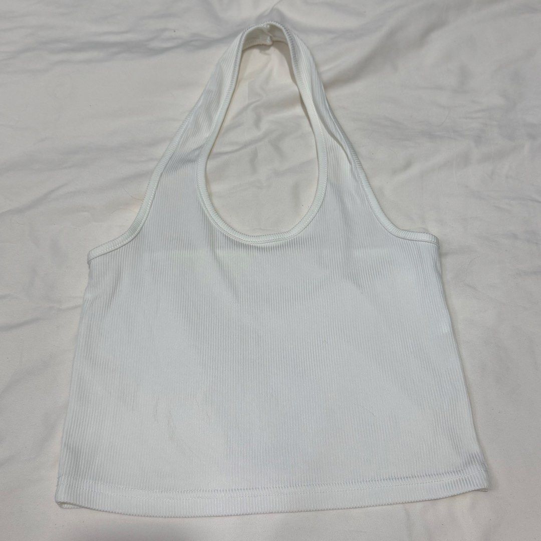 White Ribbed Halter Neck Crop Top (Category: Sleeveless) located in Manila. Submitted by halsea (Listing ID 1454192090, Image 1). Description: - White ribbed halter neck crop top - Stretchy material for a comfortable fit - Versatile: perfect for layering or wearing solo - Note: Faint marks on the front, please check photos - Plenty of wear left in this top.
