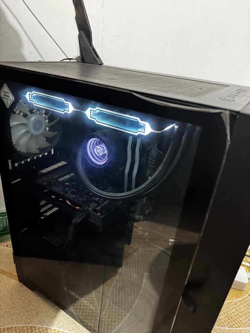 2nd Hand PC (Category: Desktops) located in Manila. Submitted by richhvict (Listing ID 1454535929, Image 2). Description: 🖥️ GAMING PC FOR SALE — ₱38,000 🎮✨ i5-12400 + RX 6500 XT | 16GB RAM | 1TB+ Storage | AIO Cooling Selling this secondhand gaming PC, purchased in July 2024. 🖤 Clean black aesthetic, tempered glass side panel, RGB lighting, and AIO liquid cooling — perfect if you want a gaming PC na powerful enough for everyday gaming/work bu