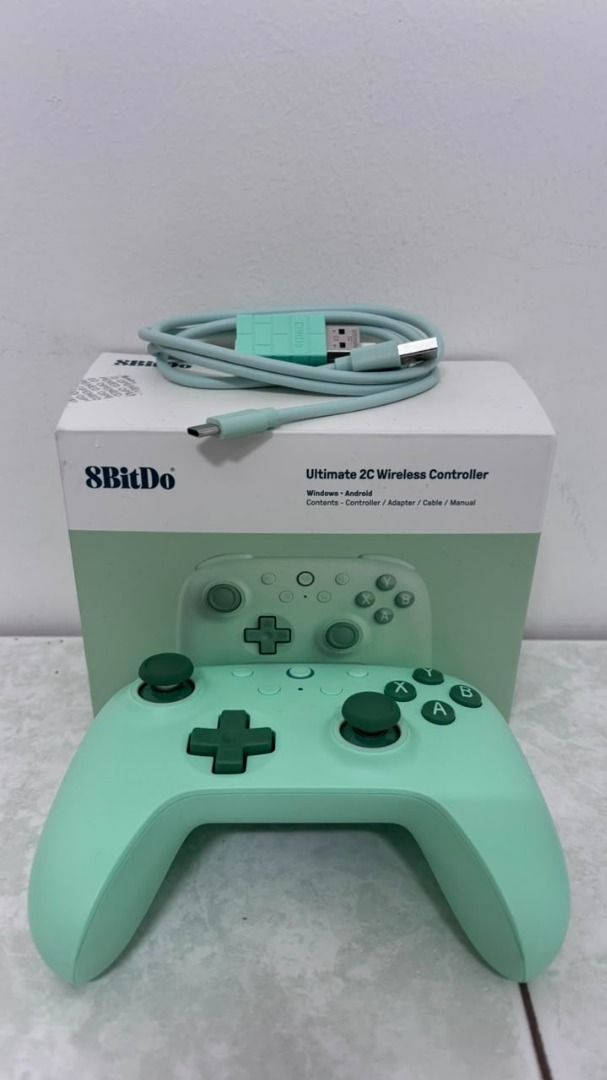 8BitDo Ultimate 2C Wireless Controller (Category: Controllers) located in Kuala Lumpur. Submitted by wildtree.960cbf (Listing ID 1454463764, Image 3). Description: - 1 x 2.4G Wireless Receiver - 1 x USB-C Cable - 1 x Instruction Manual *Features:* - *1000Hz Polling Rate:* Achieve ultra-responsive gameplay with low-latency performance, ensuring you never miss a move. - *Hall Effect Joysticks & Triggers:* Built for precision and durability, these c