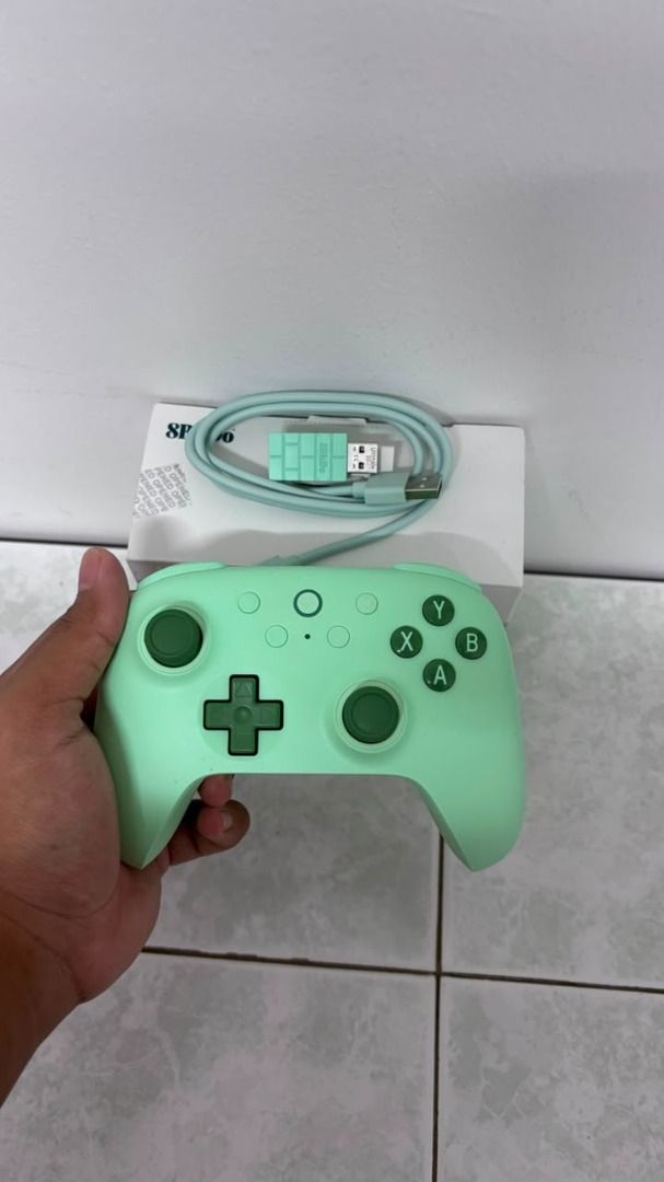 8BitDo Ultimate 2C Wireless Controller (Category: Controllers) located in Kuala Lumpur. Submitted by wildtree.960cbf (Listing ID 1454463764, Image 2). Description: - 1 x 2.4G Wireless Receiver - 1 x USB-C Cable - 1 x Instruction Manual *Features:* - *1000Hz Polling Rate:* Achieve ultra-responsive gameplay with low-latency performance, ensuring you never miss a move. - *Hall Effect Joysticks & Triggers:* Built for precision and durability, these c