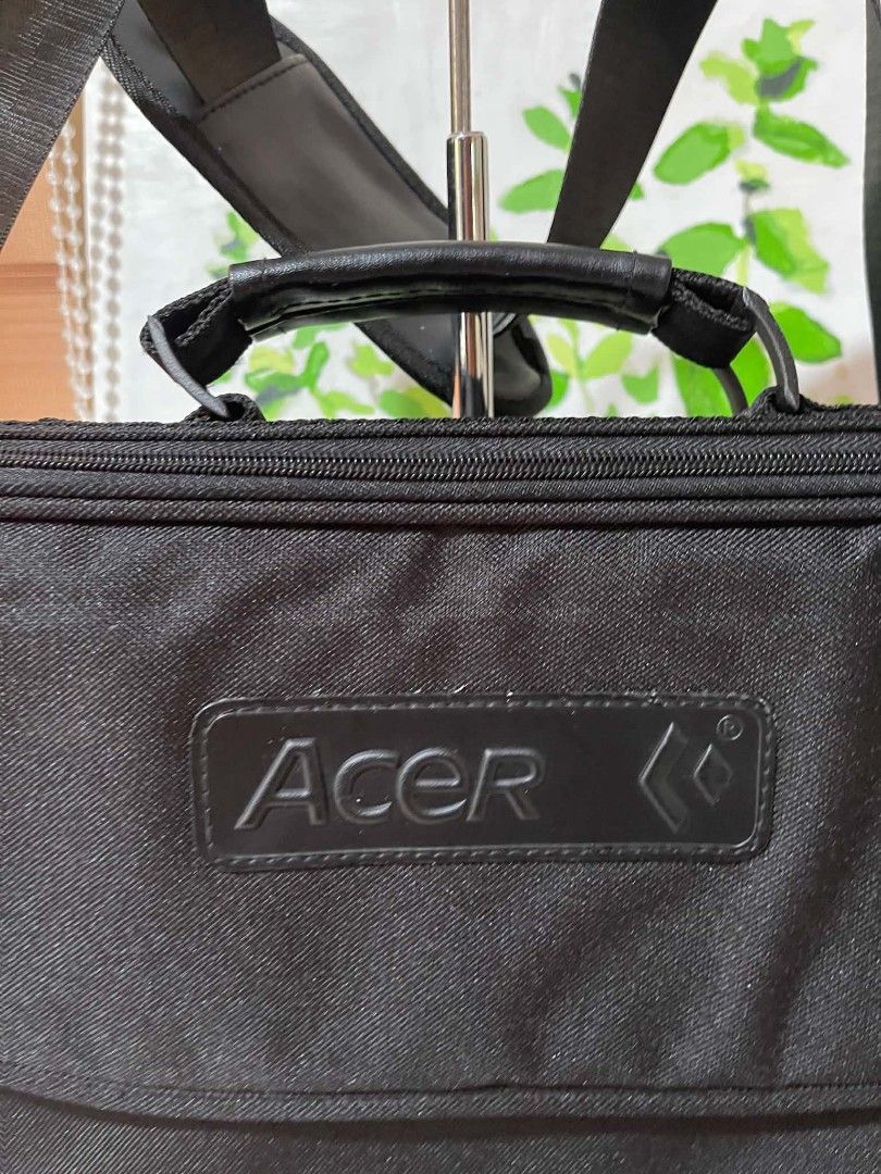 Acer Black Laptop Bag Messenger Bag (Category: Laptop Bags & Sleeves) located in Naawan. Submitted by twilly.apparel2 (Listing ID 1454379926, Image 2). Description: - change sling Black Acer laptop bag - Main zippered compartment - Secure flap closure - Adjustable shoulder strap - Approx. 15 inches wide x 11 inches tall - Durable material - Ideal for laptops and daily essentials.
