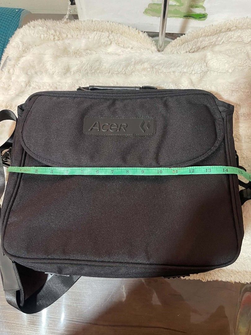 Acer Black Laptop Bag Messenger Bag (Category: Laptop Bags & Sleeves) located in Naawan. Submitted by twilly.apparel2 (Listing ID 1454379926, Image 3). Description: - change sling Black Acer laptop bag - Main zippered compartment - Secure flap closure - Adjustable shoulder strap - Approx. 15 inches wide x 11 inches tall - Durable material - Ideal for laptops and daily essentials.