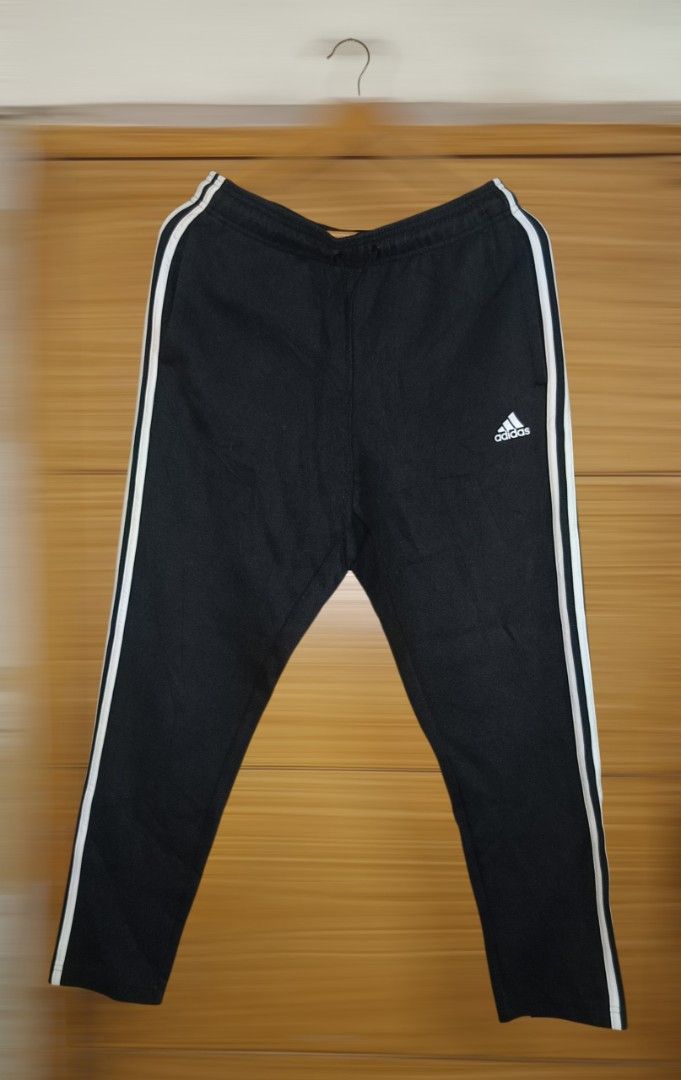 Adidas Black Track Pants with White Stripes (Category: Joggers) located in Caloocan City. Submitted by ThriftMoYanEh (Listing ID 1454559517, Image 1). Description: ADIDAS TRACK /JOGGING PANTS LIKE NEW CONDITION SIZE: LARGE DIMENSION: 32-38x39 COLOR: BLACK COLOR RATE: 10/10 NO FLAWS: NO ISSUE PANG PORMA, ASTIG PANGMOTOR ABOUT: - Adidas track pants - Black with white stripes - Size: L - Adidas logo detail - Drawstring waist - Pockets included - Mad