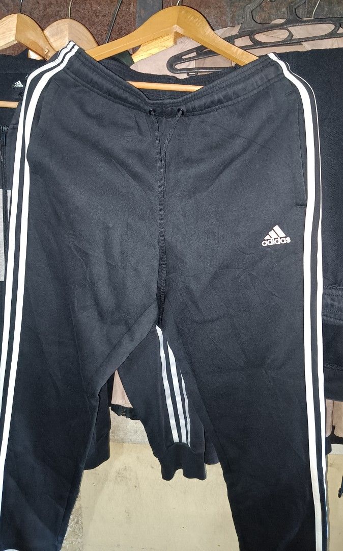 Adidas Black Track Pants with White Stripes (Category: Joggers) located in Caloocan City. Submitted by ThriftMoYanEh (Listing ID 1454559517, Image 3). Description: ADIDAS TRACK /JOGGING PANTS LIKE NEW CONDITION SIZE: LARGE DIMENSION: 32-38x39 COLOR: BLACK COLOR RATE: 10/10 NO FLAWS: NO ISSUE PANG PORMA, ASTIG PANGMOTOR ABOUT: - Adidas track pants - Black with white stripes - Size: L - Adidas logo detail - Drawstring waist - Pockets included - Mad
