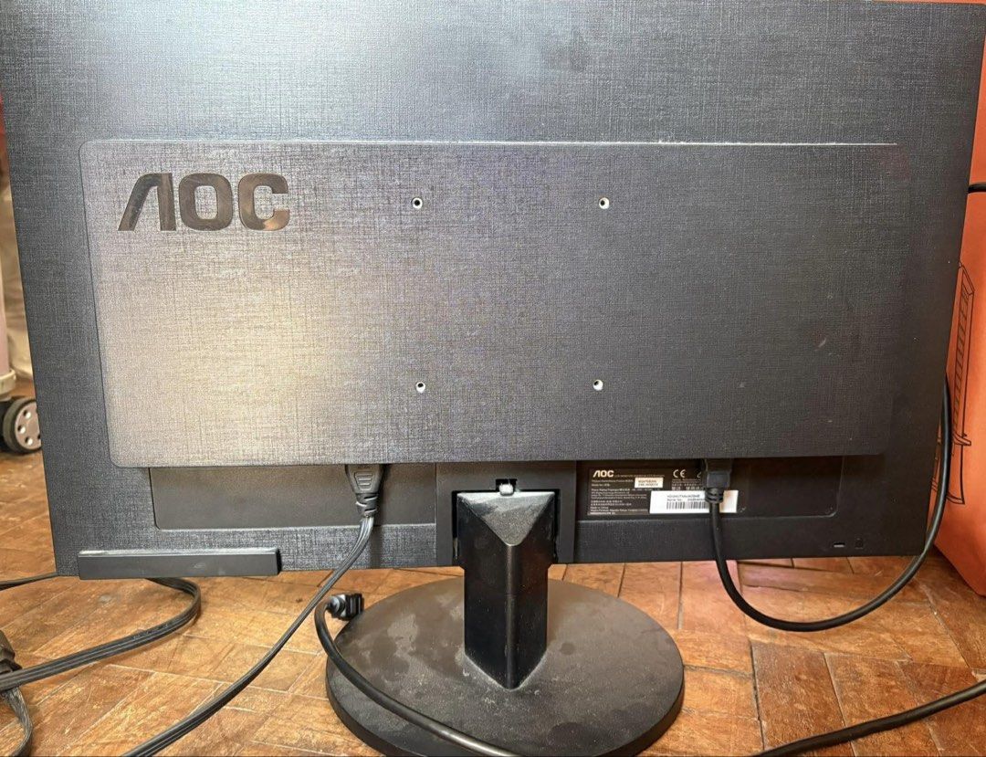 AOC Computer Monitor (Category: Monitor Screens) located in Binan City. Submitted by anamarie1088 (Listing ID 1454460499, Image 2). Description: - AOC Computer Monitor - Standard black design with a circular base - Ideal for everyday use (work, browsing, etc.) - Power cable is attached and included - Features AOC logo on the back with visible ports With free freebies Mouse Speaker.