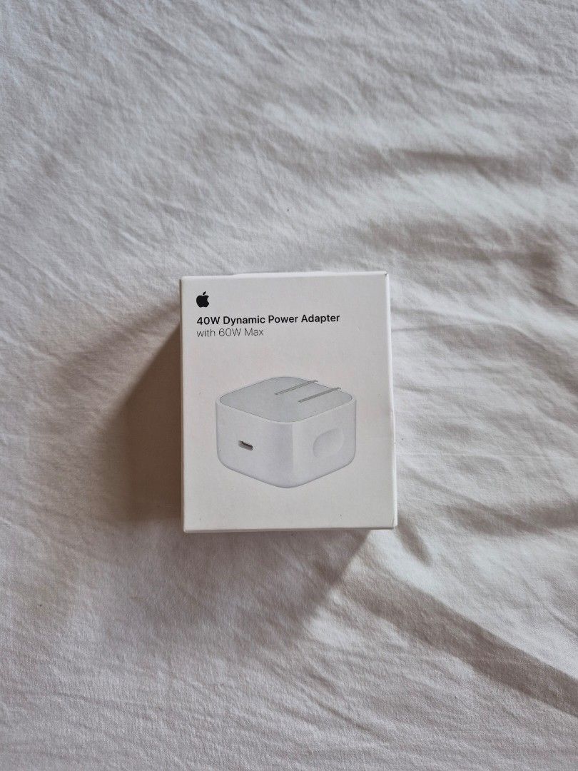 Apple 40W Dynamic Power Adapter USB-C (Category: Chargers & Cables) located in Quezon City. Submitted by ateeglobal (Listing ID 1454389644, Image 1). Description: - Original Apple 40W USB-C Power Adapter - Dynamically provides up to 40W of power - Ideal for hardware and software requiring consistent 40W with 60W Max - Includes original box - Price is firm.
