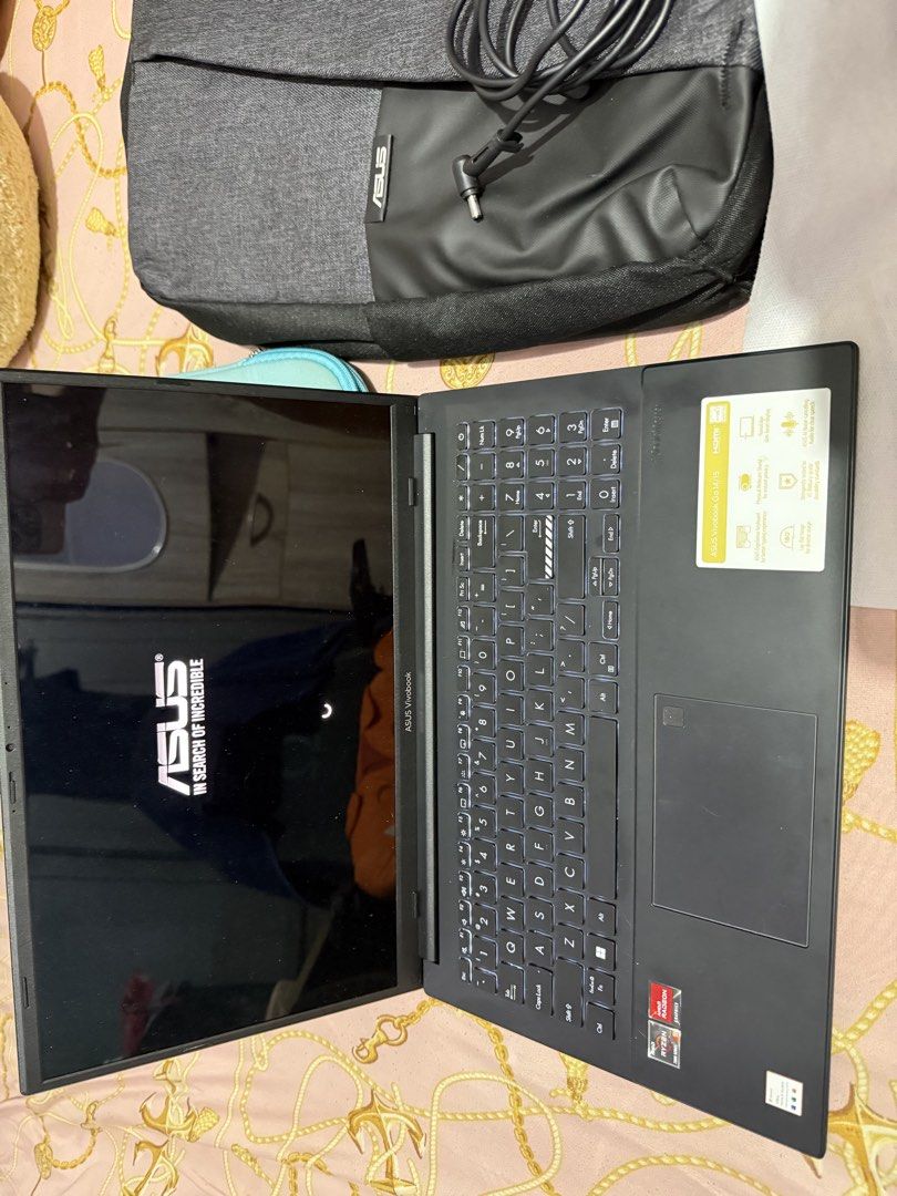 Asus Vivo book 15 OLED (Category: Laptop Bags & Sleeves) located in Caloocan City. Submitted by swiftcloud_7d0725 (Listing ID 1454378812, Image 3). Description: Alightly used, comes with laptop bag,pouch and box and charger..