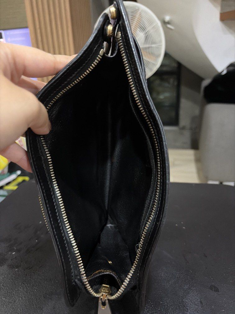 Authentic celine black macadam clutch with handle (Category: Luxury Bags & Wallets) located in Quezon City. Submitted by theyellowbasket (Listing ID 1454490821, Image 3). Description: Authentic celine black macadam With serial code Clutch with handle Issue : some tarnish on hardware .
