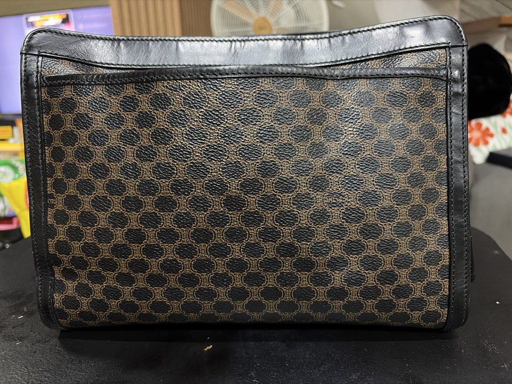 Authentic celine black macadam clutch with handle (Category: Luxury Bags & Wallets) located in Quezon City. Submitted by theyellowbasket (Listing ID 1454490821, Image 2). Description: Authentic celine black macadam With serial code Clutch with handle Issue : some tarnish on hardware .