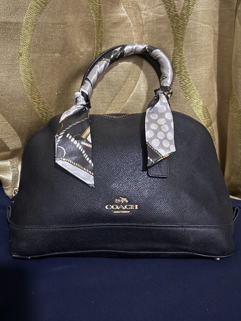 Authentic Coach Black Dome Bag (Category: Luxury Bags & Wallets) located in Manila. Submitted by handpickedbyannecox (Listing ID 1454394178, Image 1). Description: - Authentic black Coach satchel bag - Crafted from premium pebbled leather - Secure zip-top closure for your essentials - Convenient interior pockets for organization - Elegant embossed Coach logo on the front - Signs of used sa handle strap ❌No sling❌ ❌Bawal sa maarte ❌ ❌No COD❌.