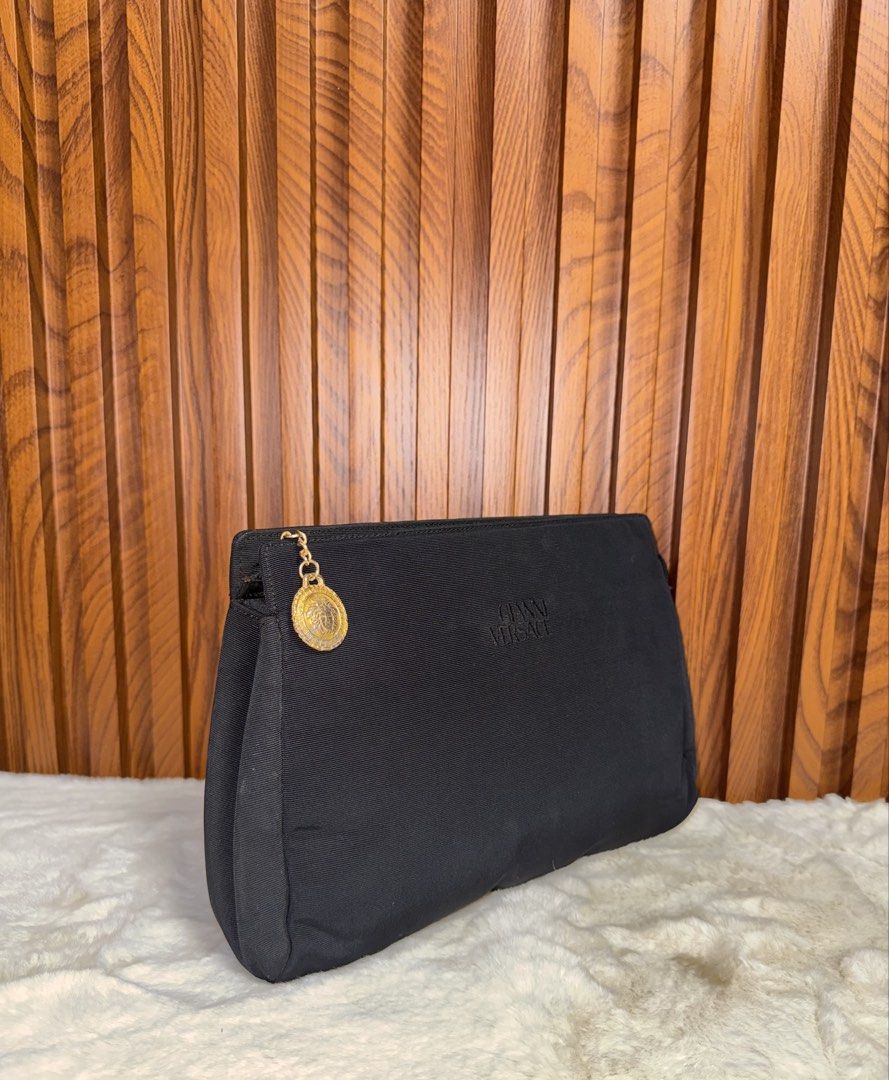 Authentic Gianni Versace Clutch Bag (Category: Everything Else Others) located in Subic. Submitted by luxshoppe88 (Listing ID 1454464464, Image 2). Description: Authentic gianni versace black clutch bag. Made in Italy. Full top zip closure. Has inner zip pocket. Siganature lining. Stil in excellent condition. Nice clutch actual. mode of payment : bpi and gcash shipping will be done once payment confirm.. or the next day. HAPPY SHOPPING!! T-H-A-N-