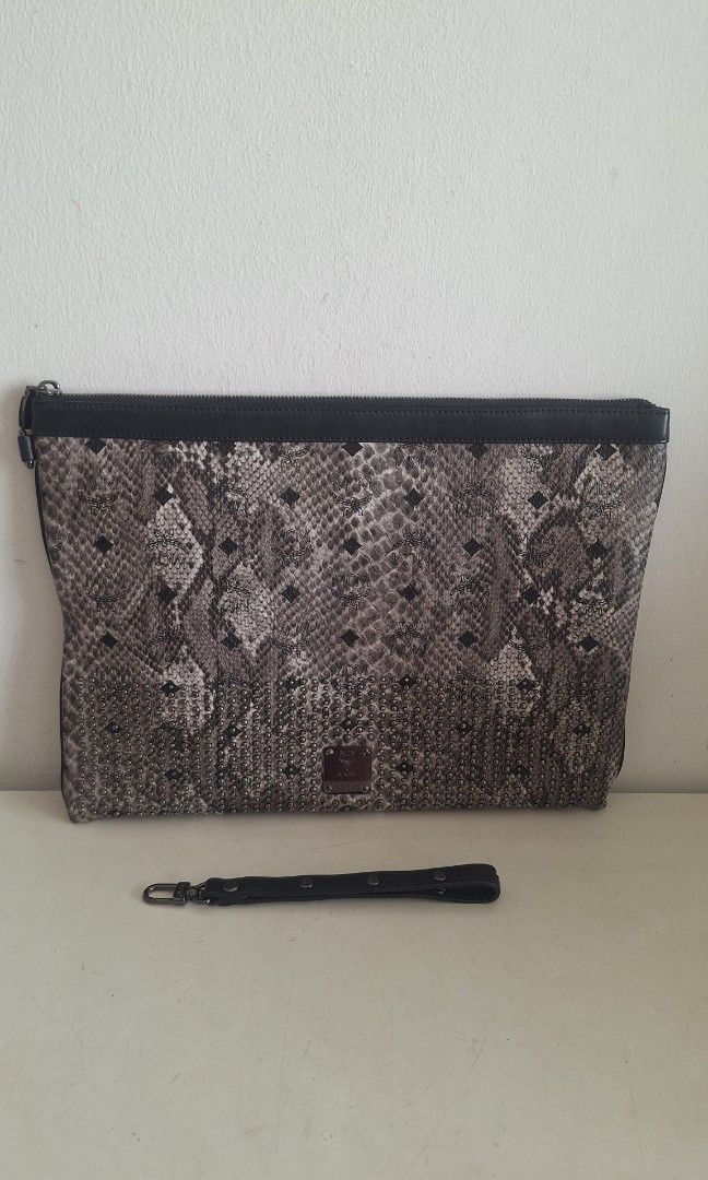 Authentic Limited Edition MCM Python Leather Document Bag (Category: Bags & Wallets) located in Singapore. Submitted by vintagehuntsg (Listing ID 1454501121, Image 1). Description: Authentic MCM python leather document bag. Measures approx. 38 x 27cm Comes with card and strap. Self collect at Choa Chu Kang ave 5 or courier can be arranged..