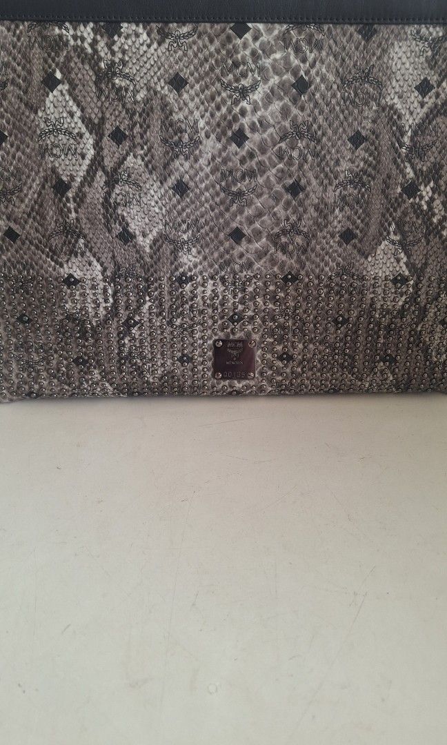 Authentic Limited Edition MCM Python Leather Document Bag (Category: Bags & Wallets) located in Singapore. Submitted by vintagehuntsg (Listing ID 1454501121, Image 3). Description: Authentic MCM python leather document bag. Measures approx. 38 x 27cm Comes with card and strap. Self collect at Choa Chu Kang ave 5 or courier can be arranged..