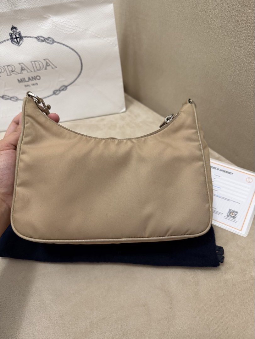 Authentic Prada Re-edition 2005 Microchipped/RFID Model (Category: Luxury Bags & Wallets) located in Manila. Submitted by maria_2326 (Listing ID 1441925267, Image 2). Description: Prada Re-edition 2005 Beige/Neutral Color Guarantee Authentic Microchipped/RFID Inclusion: Prada Sling/Strap Chain Prada Pouch Dust Bag Entrupy NO TO LOWBALLERS! Location: Manila/QC.