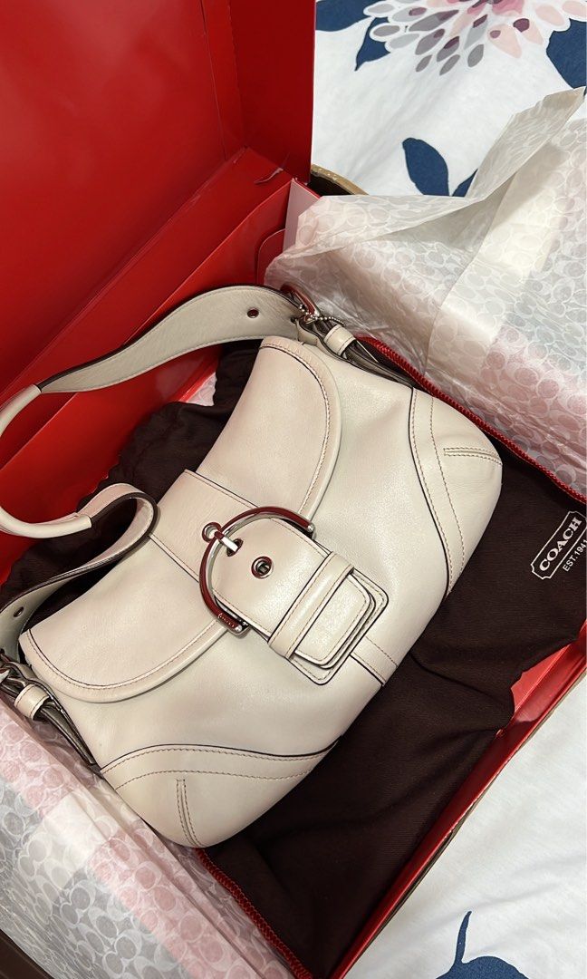 Authentic Rare Vintage Coach Mini Soho in Offwhite (Category: Shoulder Bags) located in Manila. Submitted by maviii21 (Listing ID 1454541020, Image 3). Description: Authentic Rare Vintage Coach Mini Soho in Offwhite Rank SA ✨ Excellent condition No issue With hangtag Complete inclusion: box, dustbag, card, and tissue wrap Slightly nego 🙏 Free Sf!! With free charms (if may available pa!) super super gandang bag and vv hard to source, kaso it’s no