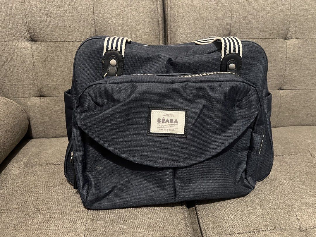 Beaba Diaper Travelling Bag (Category: Diaper Bags & Wetbags) located in Las Pinas. Submitted by r3shop2020 (Listing ID 1454393256, Image 1). Description: Beaba Geneve II Changing Bag • Color: Navy Blue (unisex ang color, bagay din kay daddy) • Barely used, dinadala lang during pedia visits. • Bought at ₱5,300 from the orange app - Beaba site last August 2025 • Complete set (insulated storage pouch, pacifier case, changing pad, shoulder strap and