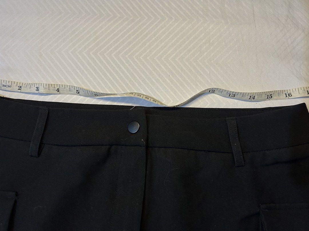 Black Cargo Mini Skirt (Category: Skirts) located in Manila. Submitted by fromrie (Listing ID 1454468335, Image 3). Description: - Black cargo mini skirt - Two front pockets - Two side flap pockets - Button and zip closure - Belt loops on waistband - Ideal for casual wear - Measurements available in photos fits 32-33 never worn.