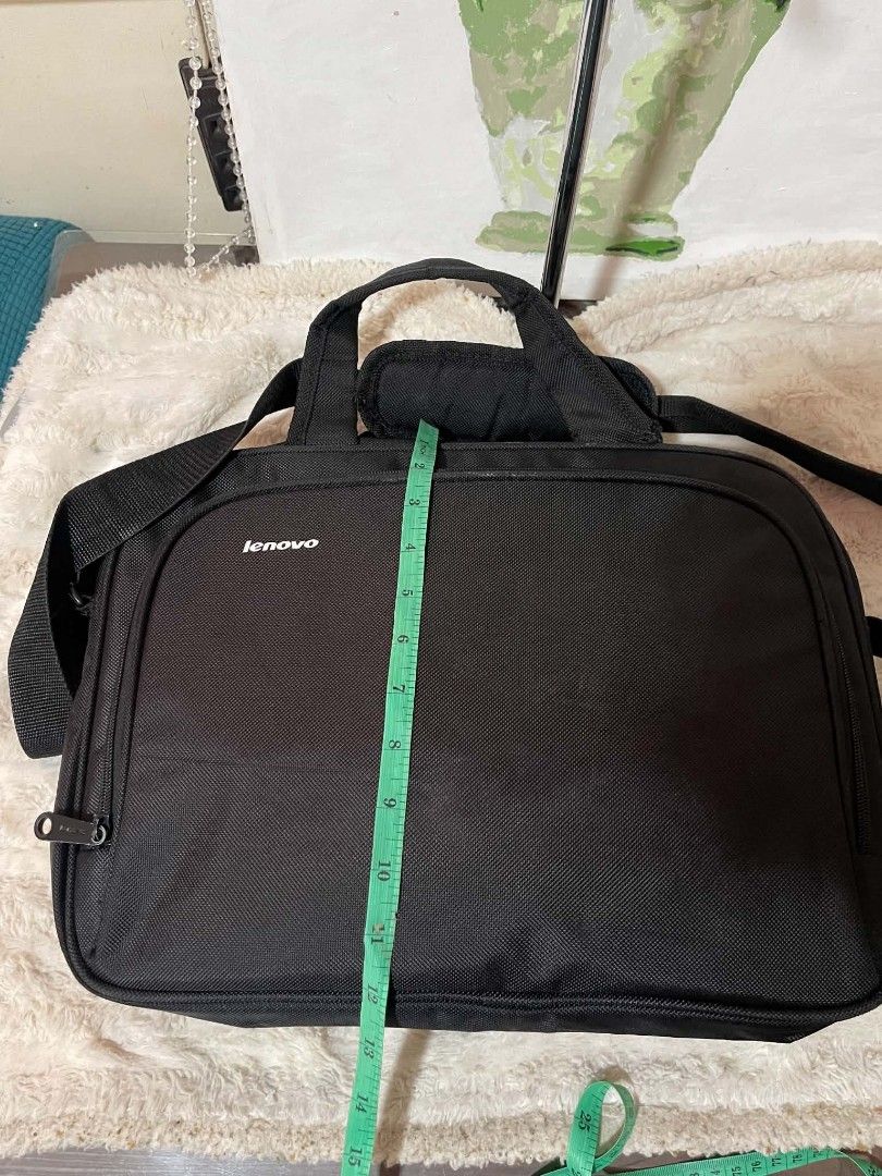 Black Lenovo Laptop Bag with Shoulder Strap (Category: Laptop Bags & Sleeves) located in Naawan. Submitted by twilly.apparel2 (Listing ID 1454378003, Image 3). Description: -issue sa handle Black Lenovo laptop bag - Approx. 16" W x 11" H - Main compartment - Front zippered pocket - Detachable shoulder strap - Top handles - Minor wear on zipper pull (see last photo).