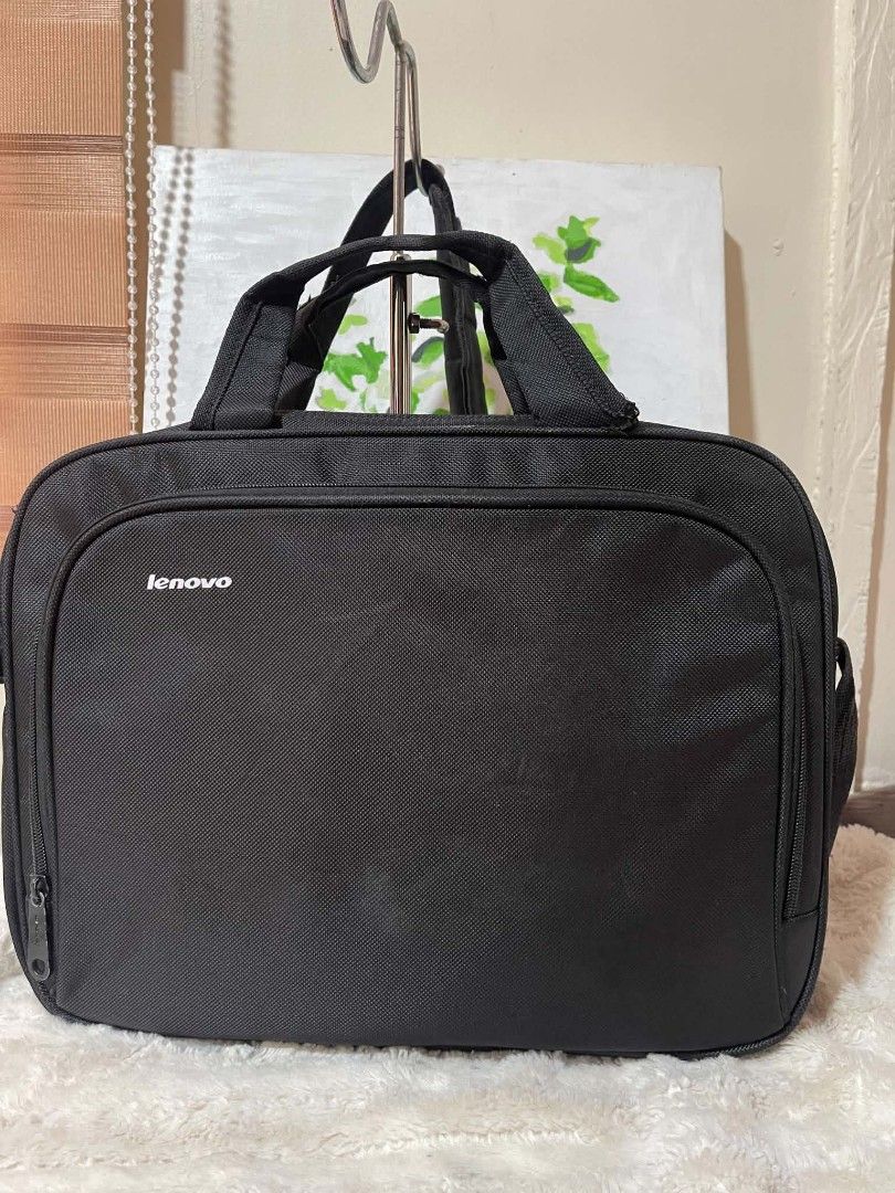 Black Lenovo Laptop Bag with Shoulder Strap (Category: Laptop Bags & Sleeves) located in Naawan. Submitted by twilly.apparel2 (Listing ID 1454378003, Image 1). Description: -issue sa handle Black Lenovo laptop bag - Approx. 16" W x 11" H - Main compartment - Front zippered pocket - Detachable shoulder strap - Top handles - Minor wear on zipper pull (see last photo).