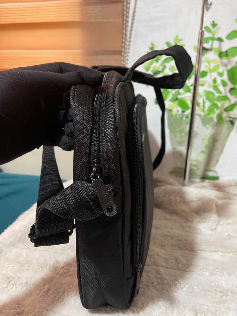 Black Lenovo Laptop Bag with Shoulder Strap (Category: Laptop Bags & Sleeves) located in Naawan. Submitted by twilly.apparel2 (Listing ID 1454378003, Image 2). Description: -issue sa handle Black Lenovo laptop bag - Approx. 16" W x 11" H - Main compartment - Front zippered pocket - Detachable shoulder strap - Top handles - Minor wear on zipper pull (see last photo).