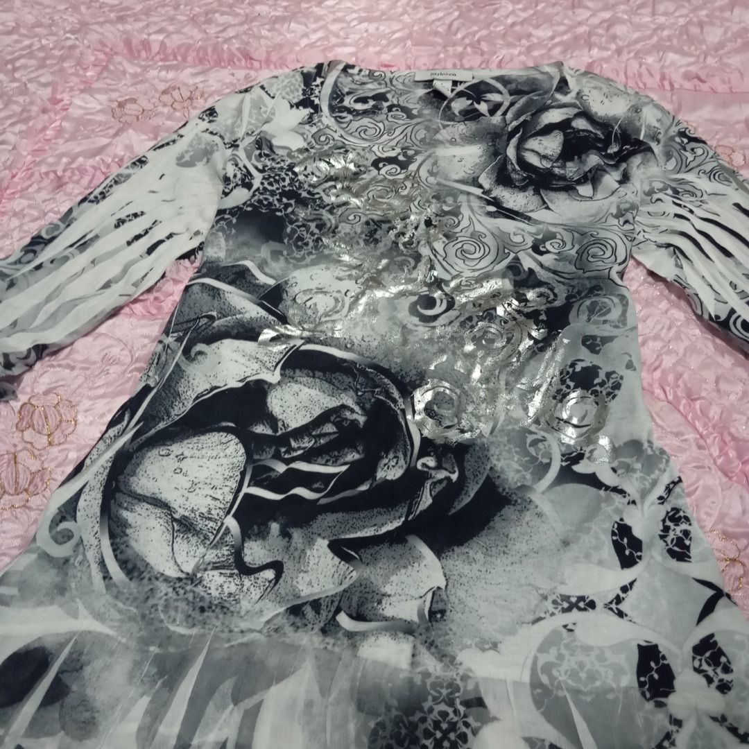 Black White Rose Grudge Print Sheer Blouse Top (Category: Blouses) located in Balanga. Submitted by elle.armoire (Listing ID 1454505483, Image 2). Description: - Style & Co. sheer blouse - Size: L - Color: Black and white - Print: Bold rose and scroll with metallic silver accents - Features: Bell sleeves - Versatile: Great for layering or wearing alone.