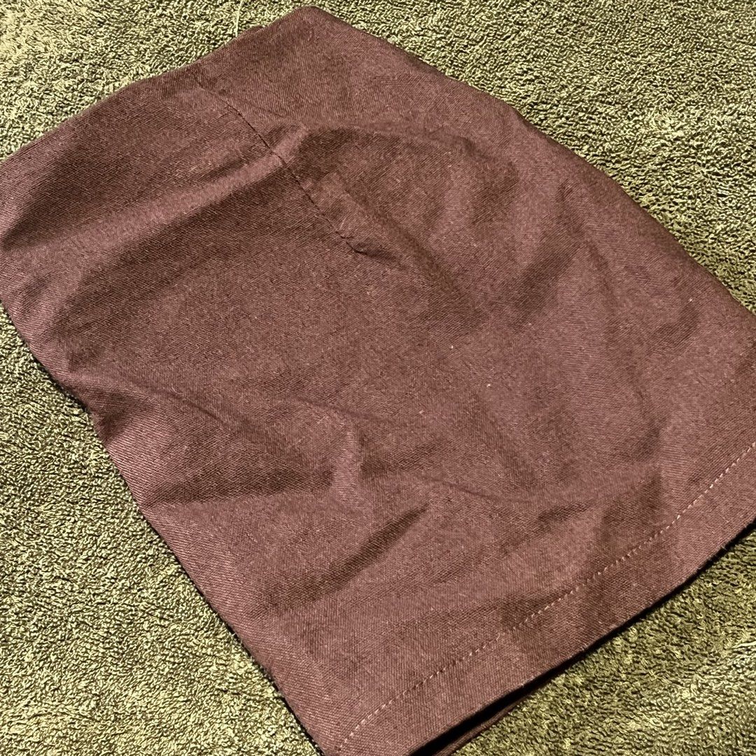 Brown Linen Mini Skirt (Category: Skirts) located in Valenzuela. Submitted by ally.declutter (Listing ID 1454386540, Image 3). Description: - Brown mini skirt - School uniform inspired design - Small detail on the front bottom - Slightly textured fabric - Versatile for various outfits.
