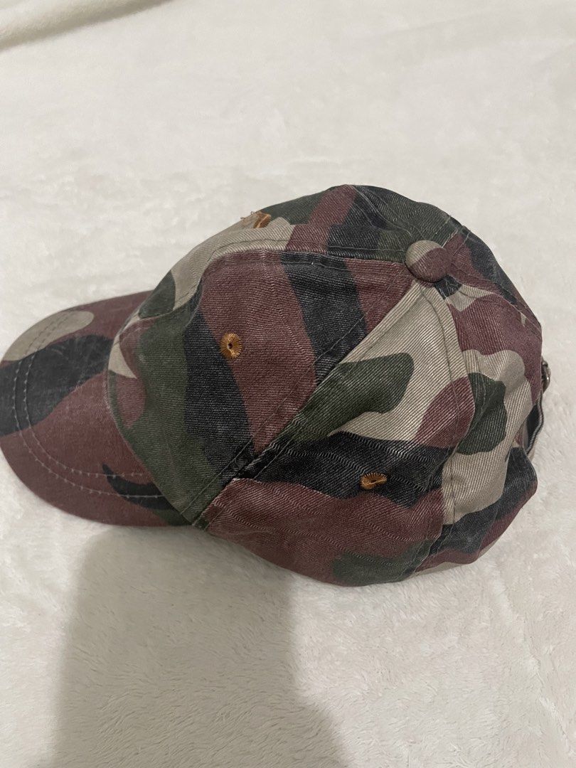 Camouflage Baseball Cap (Category: Babies & Kids Fashion) located in Guiguinto. Submitted by beatan13 (Listing ID 1454413629, Image 2). Description: - Classic camouflage design - Adjustable strap for a comfortable fit - Made from durable cotton material - Ideal for casual wear and outdoor adventures - Versatile and easy to style with any outfit.
