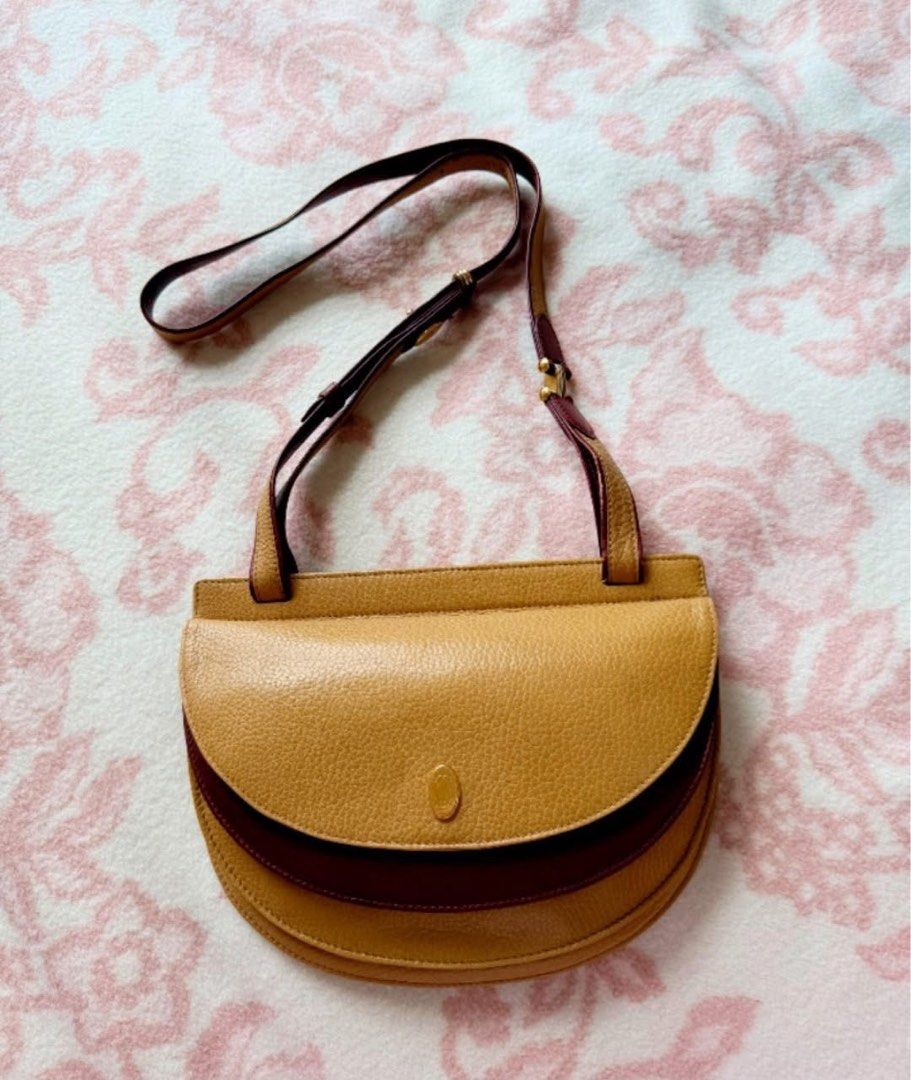 Cartier Bag (Category: Luxury Bags & Wallets) located in Quezon City. Submitted by liezl.marie (Listing ID 1454479610, Image 2). Description: Authentic vintage Must de C@rt!a€r Trinity Half-Moon leather shoulder bag. 14,800 Open for layaway. Disclaimer: We are not affiliated, associated, authorized, endorsed by or in any way officially connected with any other company or luxury brand. All copyrights are reserved to the original brand..