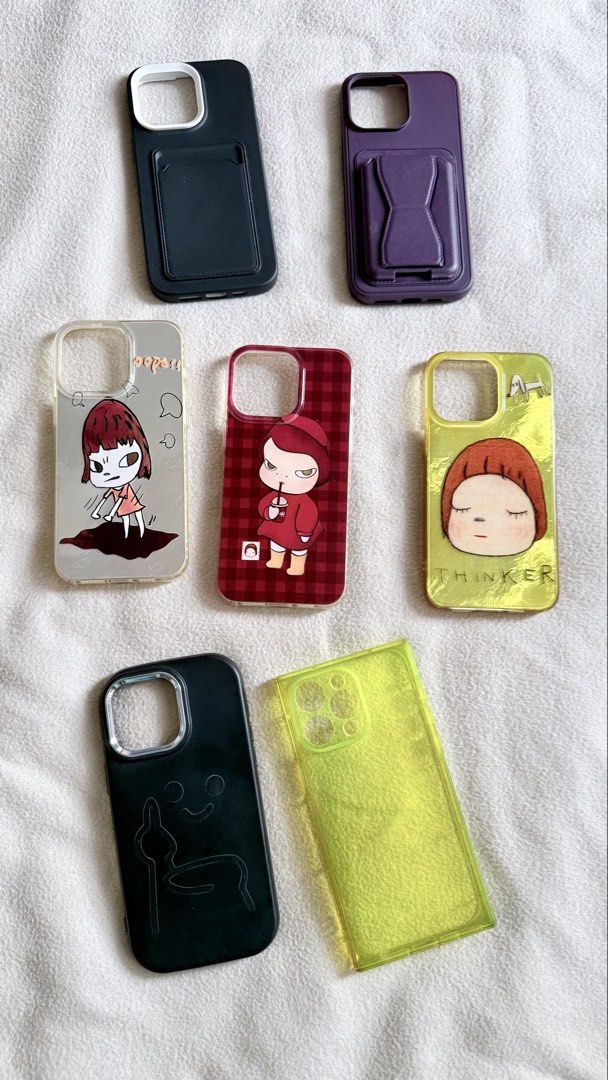 cases for iPhone 15 pro max (Category: Cases & Sleeves) located in Valenzuela. Submitted by jatentenenen (Listing ID 1454439796, Image 1). Description: 7 random cases for iPhone 15 Pro Max, sold as a set. All bought from the orange app. 2 top cases (black/white and plum, both with card slots) never been used. Only tried. But never used. Other 5, used on a daily 3 mid cases - may metallic effect na matingkad. Check 2nd photo Plum case can be turne