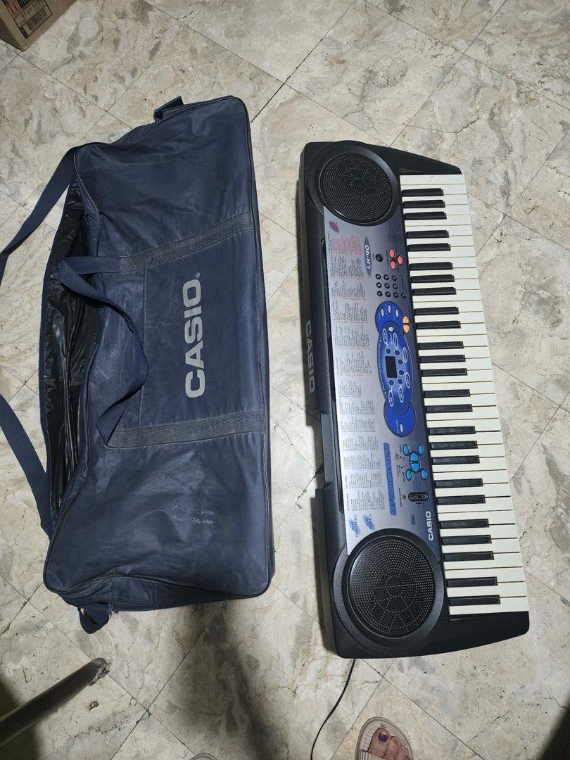 Casio LK-40 Keyboard with Carry Bag and Stand (Category: Computer Keyboard) located in Manila. Submitted by kathy_gonzales (Listing ID 1454483589, Image 1). Description: - Casio LK-40 Keyboard - Functional Key Lighting System (Great for Learning!) - Includes Casio Carry Bag - 100 Song Bank Tunes - Built-in Speakers - Ideal for Beginners Wala lang dyan yung picture ng stand pero may stand po yan. Thanks!.