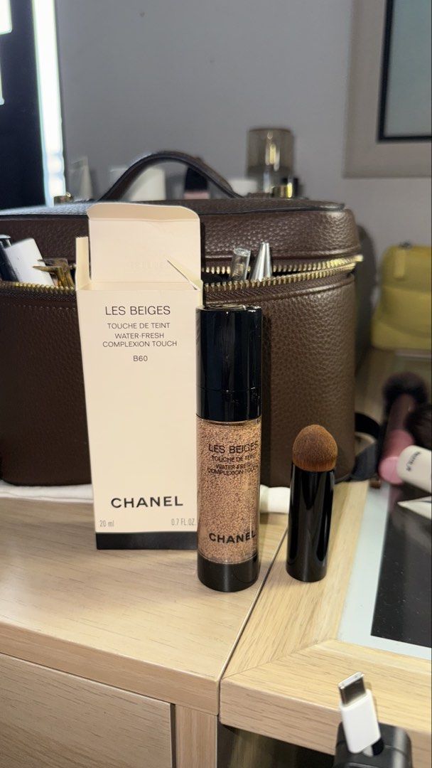 Chanel Les Beiges Water-Fresh Complexion Touch B60 (Category: Makeup) located in Manila. Submitted by p1llowsells (Listing ID 1454391243, Image 2). Description: - Chanel Les Beiges Water-Fresh Complexion Touch - Shade: B60 - Size: 20ml - Includes original box and applicator brush - Purchased from Pasabuy London Orange App - RFS: SWATCHED TODAY AUG 8 ONCE AND NEVER USED AGAIN ITS EXACTLY MY SHADE RIGHT NOW BUT I WANTED IT DARKER - Delivery Date: A