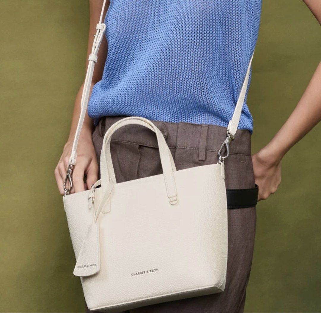 Charles and Keith Mini Beryl Tote Bag (Category: Tote Bags) located in Cebu City. Submitted by thegoodcatchceb (Listing ID 1454505886, Image 2). Description: -Medium -Condition: Excellent / Pre-loved (used only 4 times exclusively for wedding events). It has been carefully kept in storage and is looking for a new home where it will actually get used! -Details: twin top handles, and a matching luggage-style tag/charm. It also comes with an adjusta