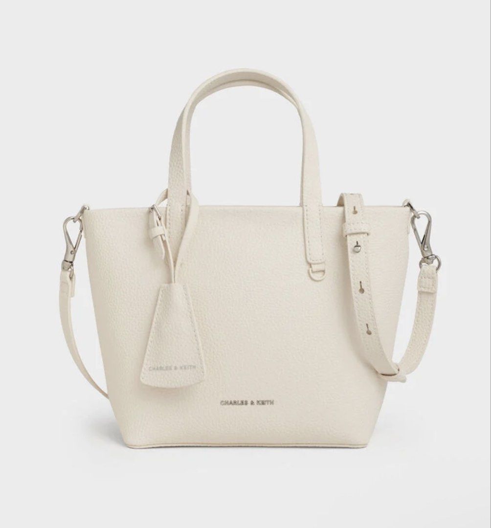 Charles and Keith Mini Beryl Tote Bag (Category: Tote Bags) located in Cebu City. Submitted by thegoodcatchceb (Listing ID 1454505886, Image 1). Description: -Medium -Condition: Excellent / Pre-loved (used only 4 times exclusively for wedding events). It has been carefully kept in storage and is looking for a new home where it will actually get used! -Details: twin top handles, and a matching luggage-style tag/charm. It also comes with an adjusta