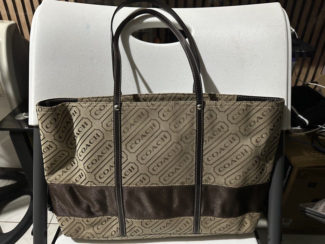 Coach Monogram Canvas & Leather Tote Bag (Category: Shoulder Bags) located in Manila. Submitted by chinitangtisay (Listing ID 1454418723, Image 3). Description: - Classic Coach tote bag - Beige canvas with all-over 'COACH' logo print - Dark brown leather accents and straps - Secure zipper closure - Spacious interior with pockets - Ideal for daily use and practicality.