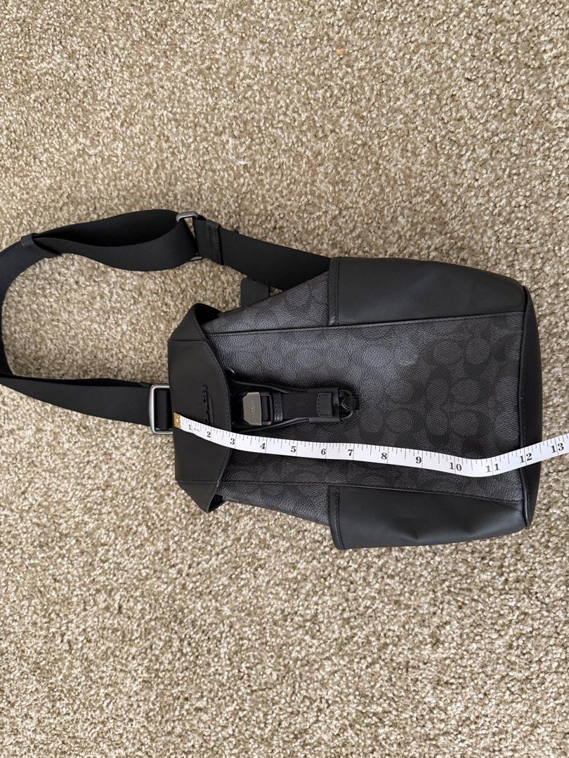 Coach Signature Sling Bag Black (Category: Luxury Bags & Wallets) located in Quezon City. Submitted by cool_guy_z (Listing ID 1454556401, Image 1). Description: never been worn. Signature canvas and refined leather design. Hands-free with the detachable strap to change orientation. Has space for phone, cards, cash and more. Pick up in Long Island City.
