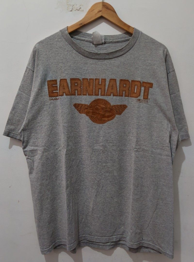 Dale Earnhardt NASCAR (The Intimidator) (Category: Tshirts & Polo Shirts ) located in Taguig. Submitted by wethrifting2021 (Listing ID 1454387900, Image 1). Description: Item: Dale Earnhardt (Intimidator The Man)🔥 ‎Size: Chase Authentic (L) ‎Width: 23 ‎Length: 29.5 ‎Condition: Excellent ‎Issue: Multiple Pin& Penhole, Minimal Hairline&Stain SWIPE MORE DETAILS. DM to purchase 📩.