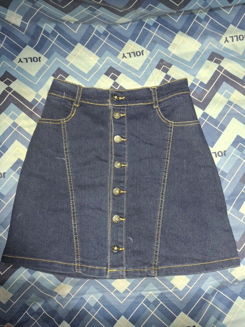 Denim Skirt (Category: Skirts) located in Manila. Submitted by nadz.declutter (Listing ID 1454414858, Image 1). Description: - Classic dark wash denim skirt - Full button-front closure - Flattering A-line cut - Two functional front pockets - Belt loops for styling options - Versatile for everyday casual outfits.