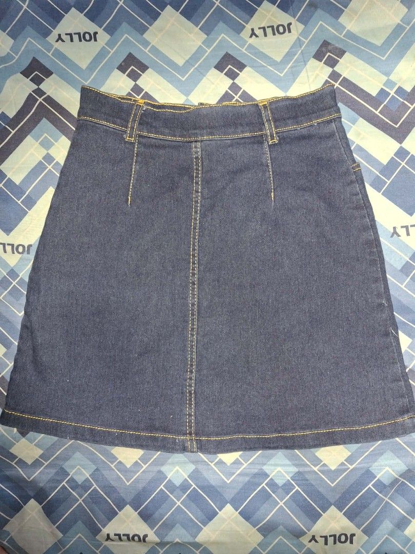 Denim Skirt (Category: Skirts) located in Manila. Submitted by nadz.declutter (Listing ID 1454414858, Image 2). Description: - Classic dark wash denim skirt - Full button-front closure - Flattering A-line cut - Two functional front pockets - Belt loops for styling options - Versatile for everyday casual outfits.