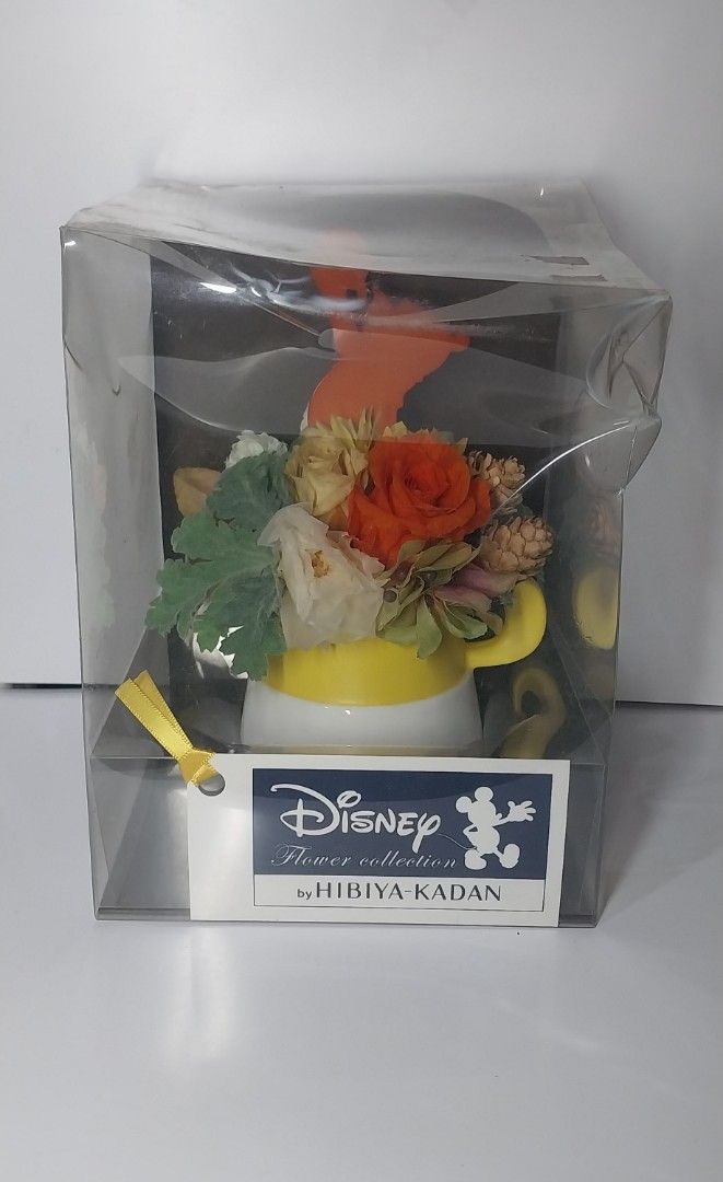 Disney Flower Collection (Category: Flowers & Bouquets) located in Pililla. Submitted by anik_ni_em (Listing ID 1454459662, Image 1). Description: Disney Flower Collection arrangement by Hibiya-Kadan featuring preserved flowers in a character-themed mug. -issue ung plastik box as seen on pic -as is -WYSIWYG MOP: Gcash + Shipping.