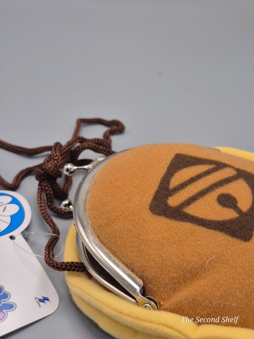 Doraemon Dorayaki Plush Coin Purse (Category: Purses & Pouches) located in Santa Rosa. Submitted by thesecondshelf (Listing ID 1454518047, Image 3). Description: Doraemon Dorayaki Plush Coin Purse Japanese Character Mini Pouch with Tag ₱250 Cute and collectible Doraemon-themed coin purse designed to resemble a dorayaki. Features a soft plush exterior, kiss-lock metal closure, and matching neck cord. Great for coins, earphones, small accessories, 