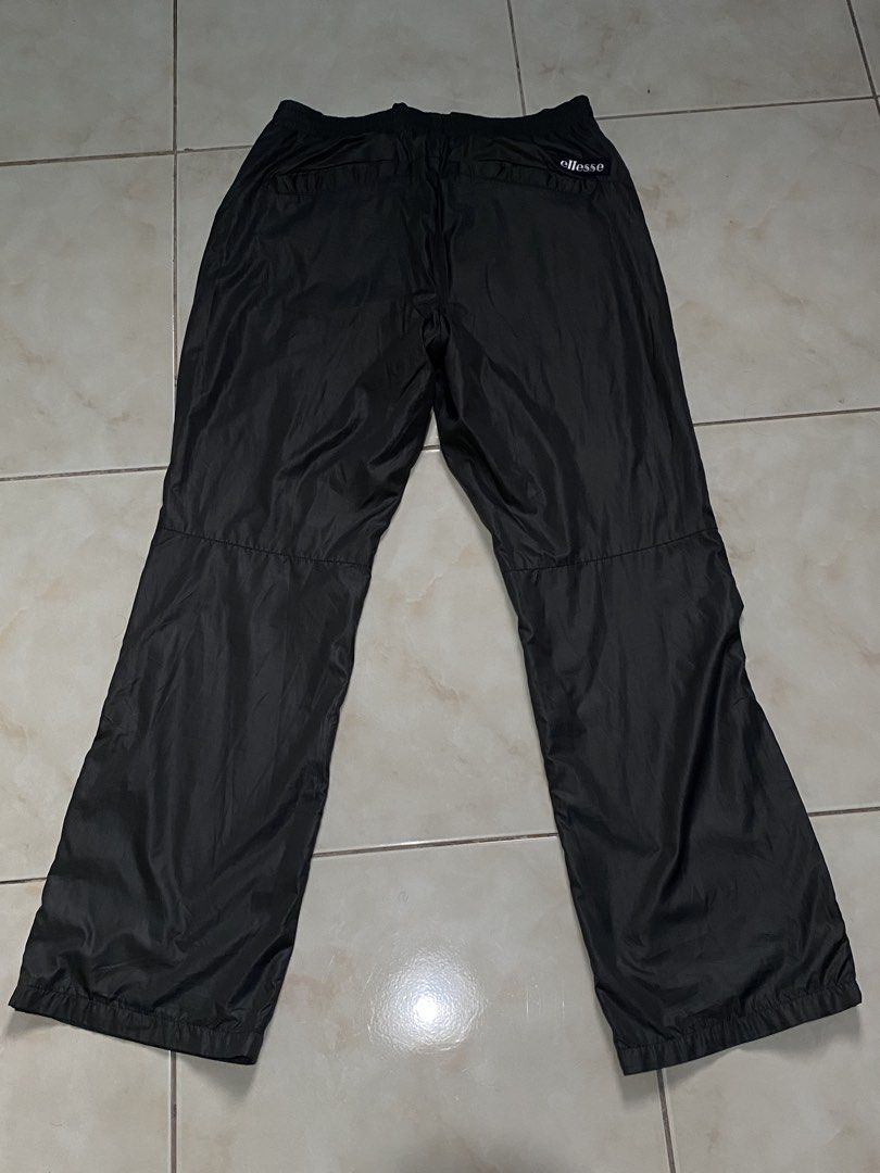 Ellesse Black Nylon Track Pants (Category: Joggers) located in Pasig City. Submitted by teddae (Listing ID 1454368173, Image 1). Description: Ellesse Black Nylon Track Pants complete tags size S 30-31 length 39.5 leg hole 9 no issues can do COD/Gcash mop or meetup if nearby -buyer will handle the shipping fee-.