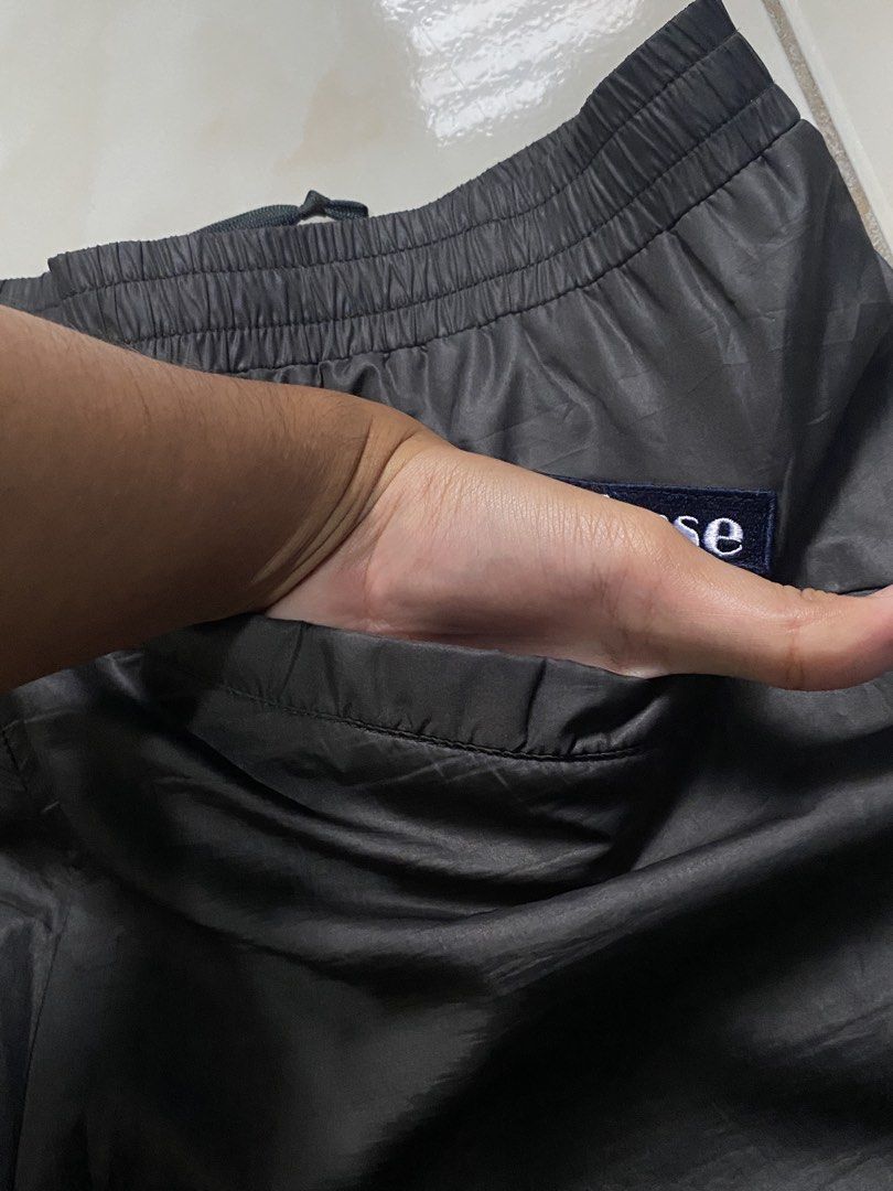 Ellesse Black Nylon Track Pants (Category: Joggers) located in Pasig City. Submitted by teddae (Listing ID 1454368173, Image 2). Description: Ellesse Black Nylon Track Pants complete tags size S 30-31 length 39.5 leg hole 9 no issues can do COD/Gcash mop or meetup if nearby -buyer will handle the shipping fee-.