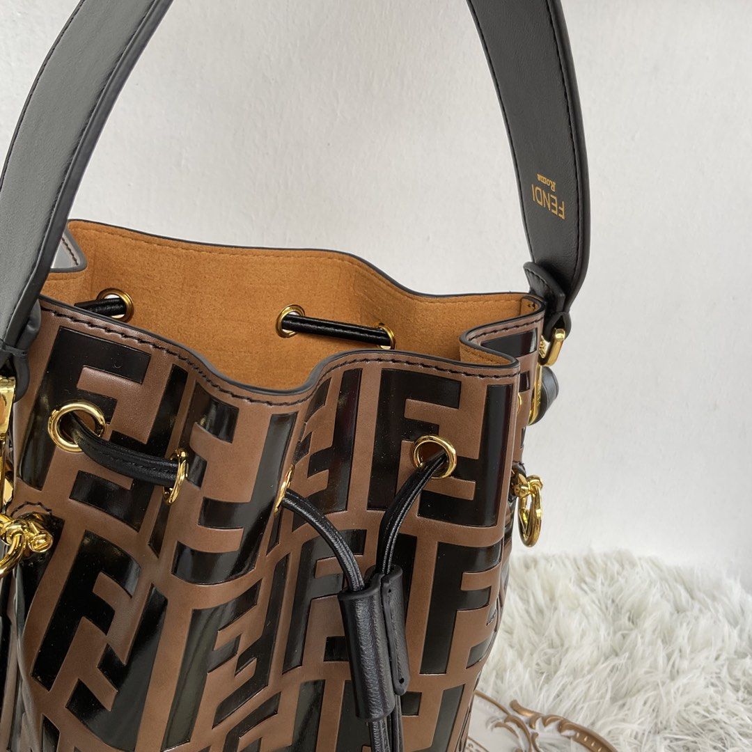 Fendi Monogram Bucket Bag Brown Black (Category: Luxury Bags & Wallets) located in San Fernando. Submitted by seokjinnie08 (Listing ID 1454381915, Image 3). Description: - Fendi bucket bag - Classic brown and black FF monogram pattern - Genuine leather trim - Secure drawstring closure - Elegant gold hardware - Comes with original dust bag - Ideal for everyday style and practicality Japan preloved.